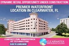 Flyer advertising a premier waterfront retail opportunity under construction in Clearwater, FL, featuring a rendering of a multi-story building and a call to contact for leasing information.