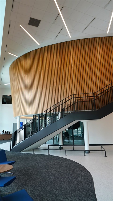 a staircase and seating in a building