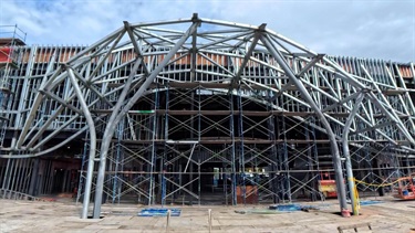 Exterior of the new city hall under construction showing clamshell entrance