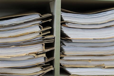 Image of files stacked on desk