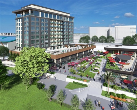 view of new hotel with green area and outside area