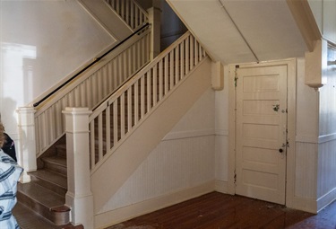 Image of staircase and closet door