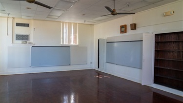 Empty room with white walls and wood floor