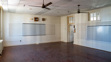Empty room with white walls and wood floor