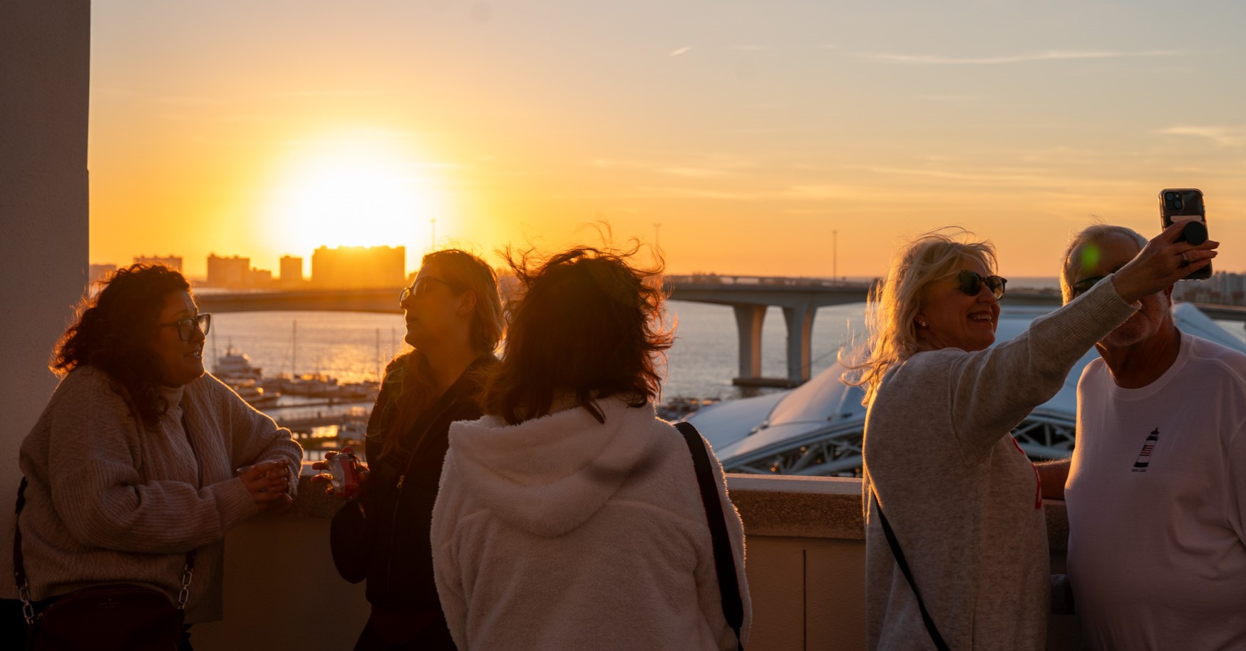 People enjoying the sunset and taking photos