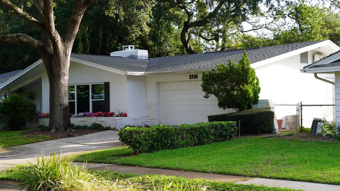 a white house in a neighborhood