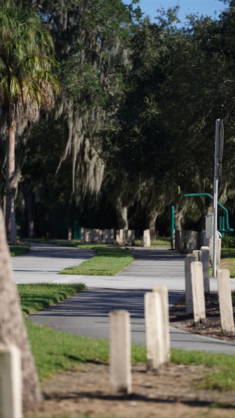 a trail running along concrete barriers