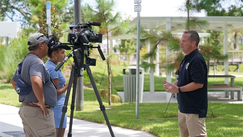 A person being interviewed by television personalities