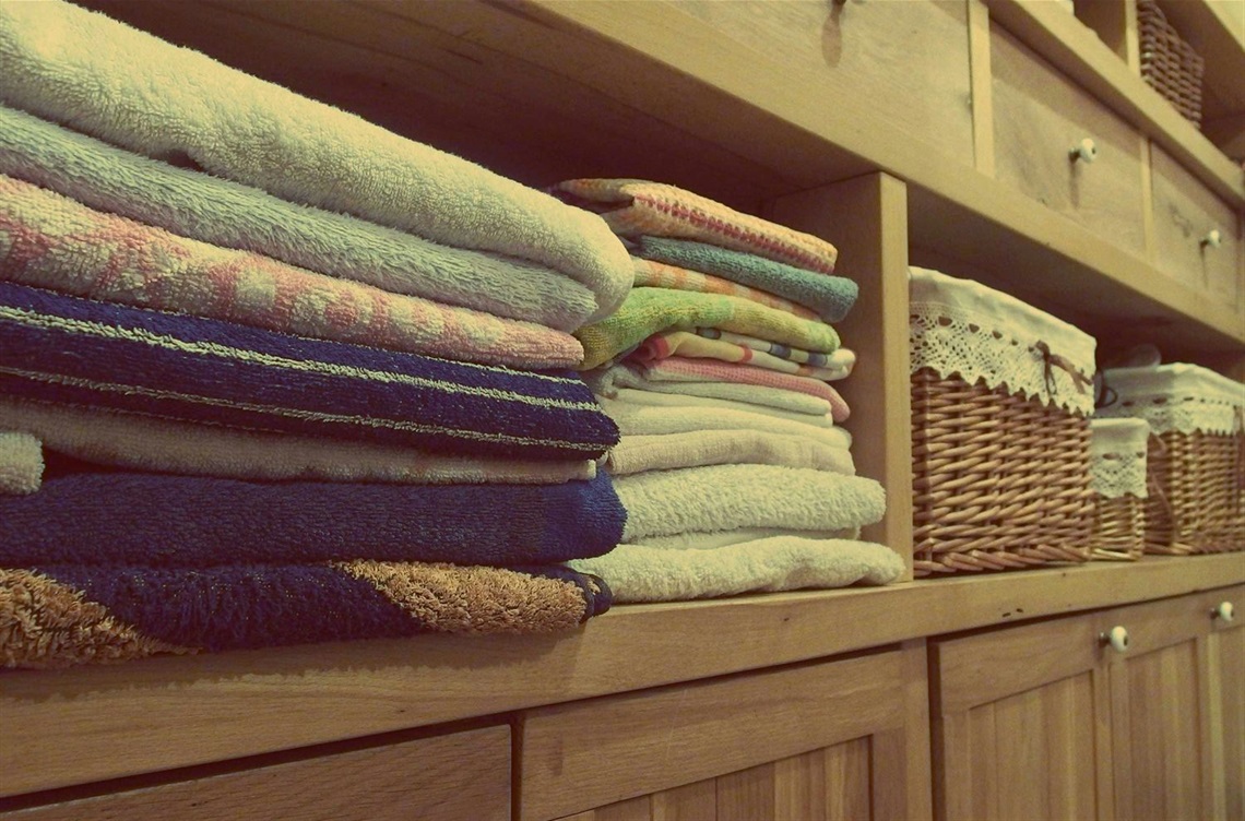 This is a photo of towels and blankets to be organized during spring cleaning.