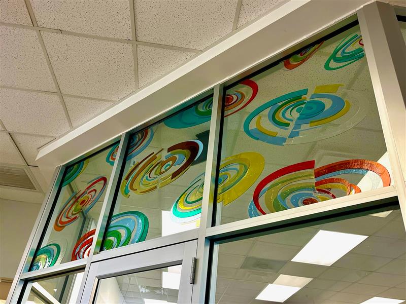 Transparent color circles on glass in recreation center