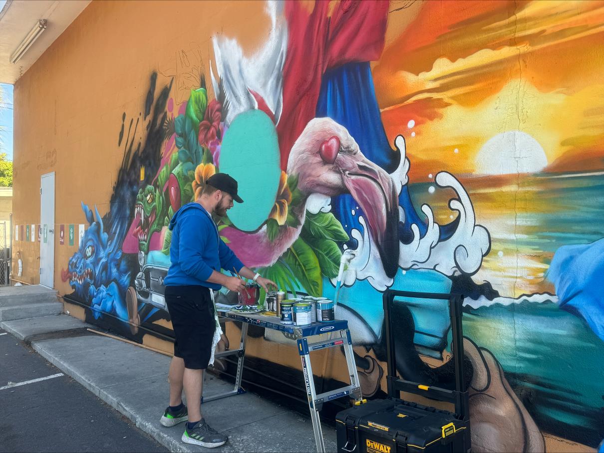 Artist painting a mural