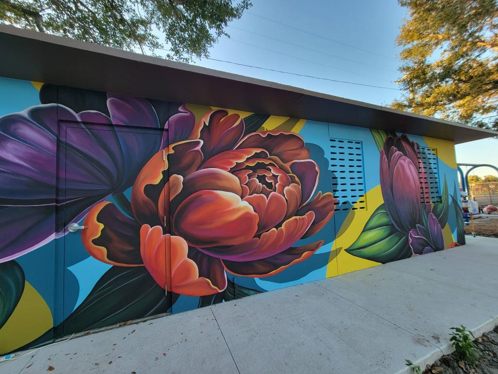 Exterior wall mural of flowers.