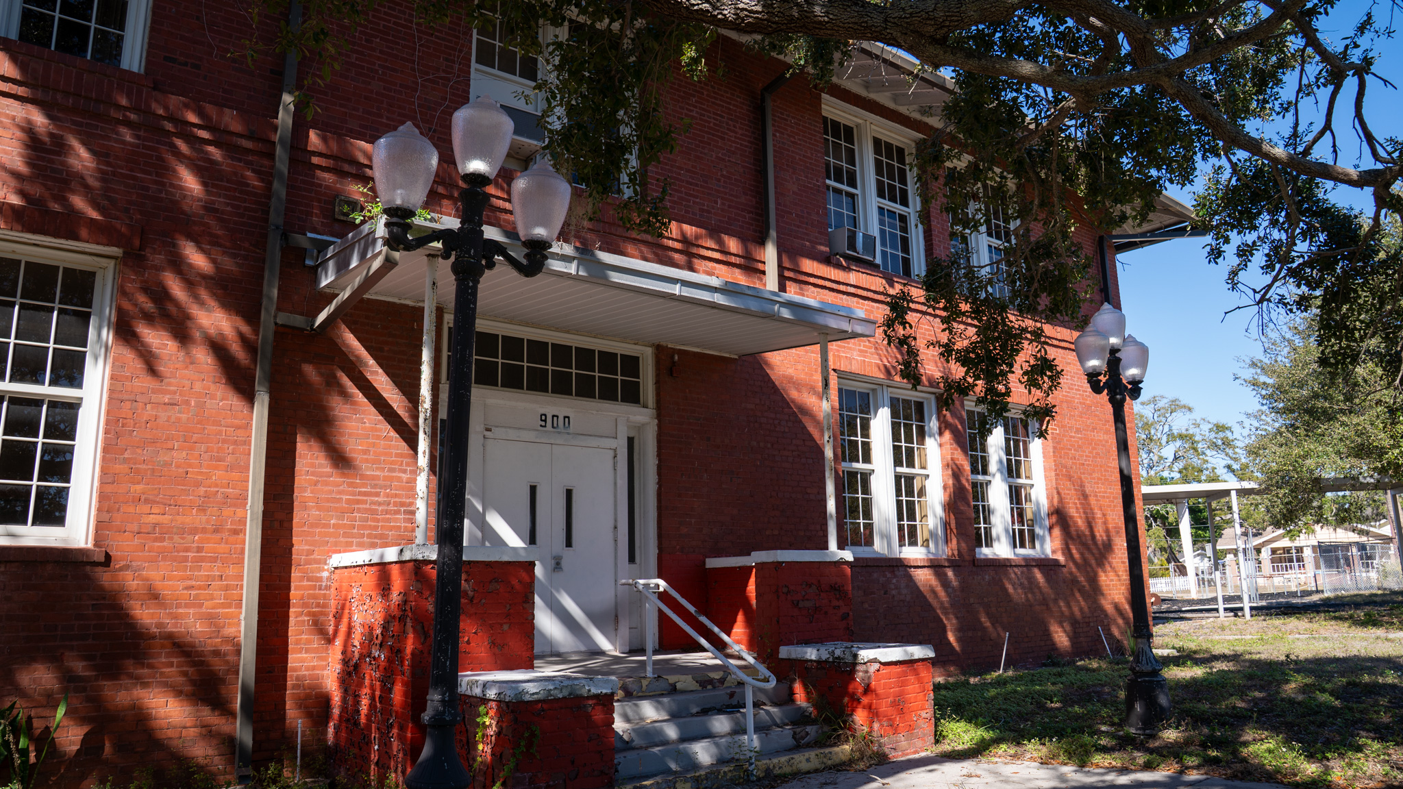 Exterior of red brick building and entrance doors