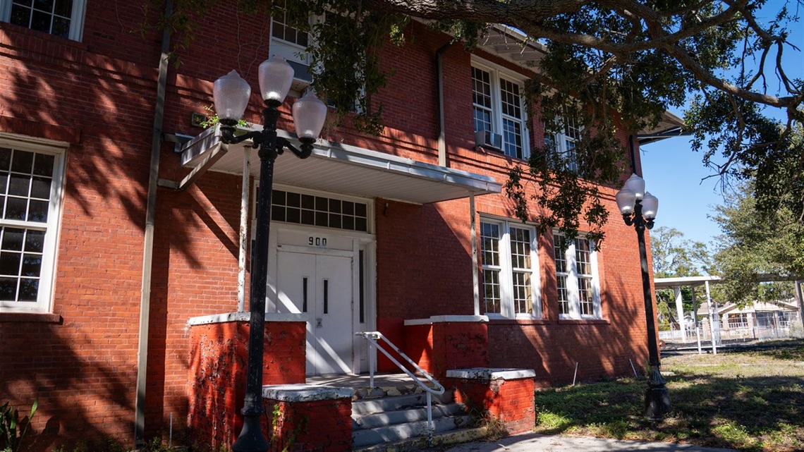 Exterior of red brick building and entrance doors