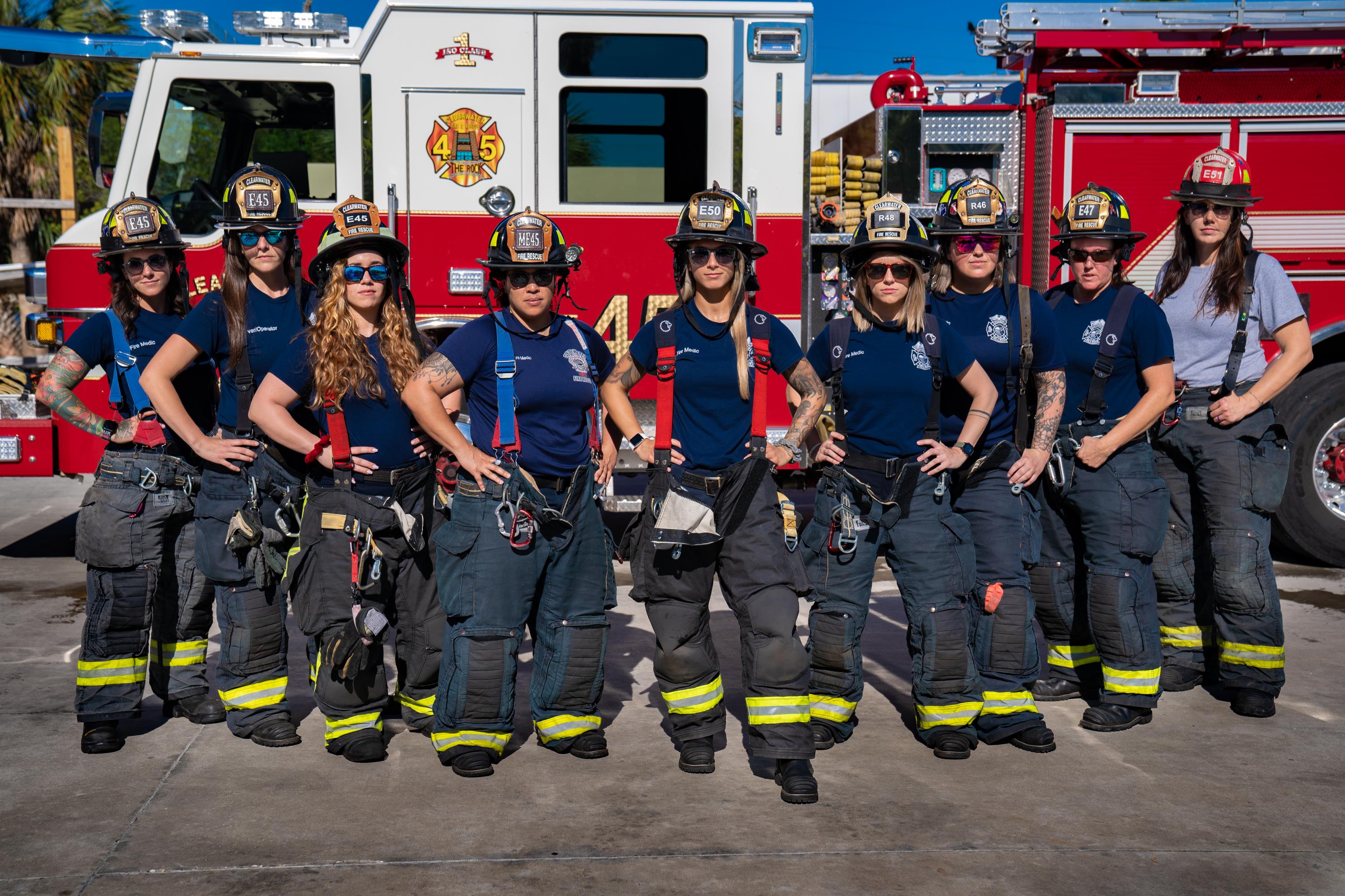 firefighters standing in front of truck