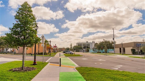 Intersection of two streets, one coming in at a forty five degree angle.