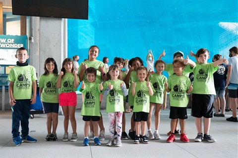 Summer Campers standing at an aquarium