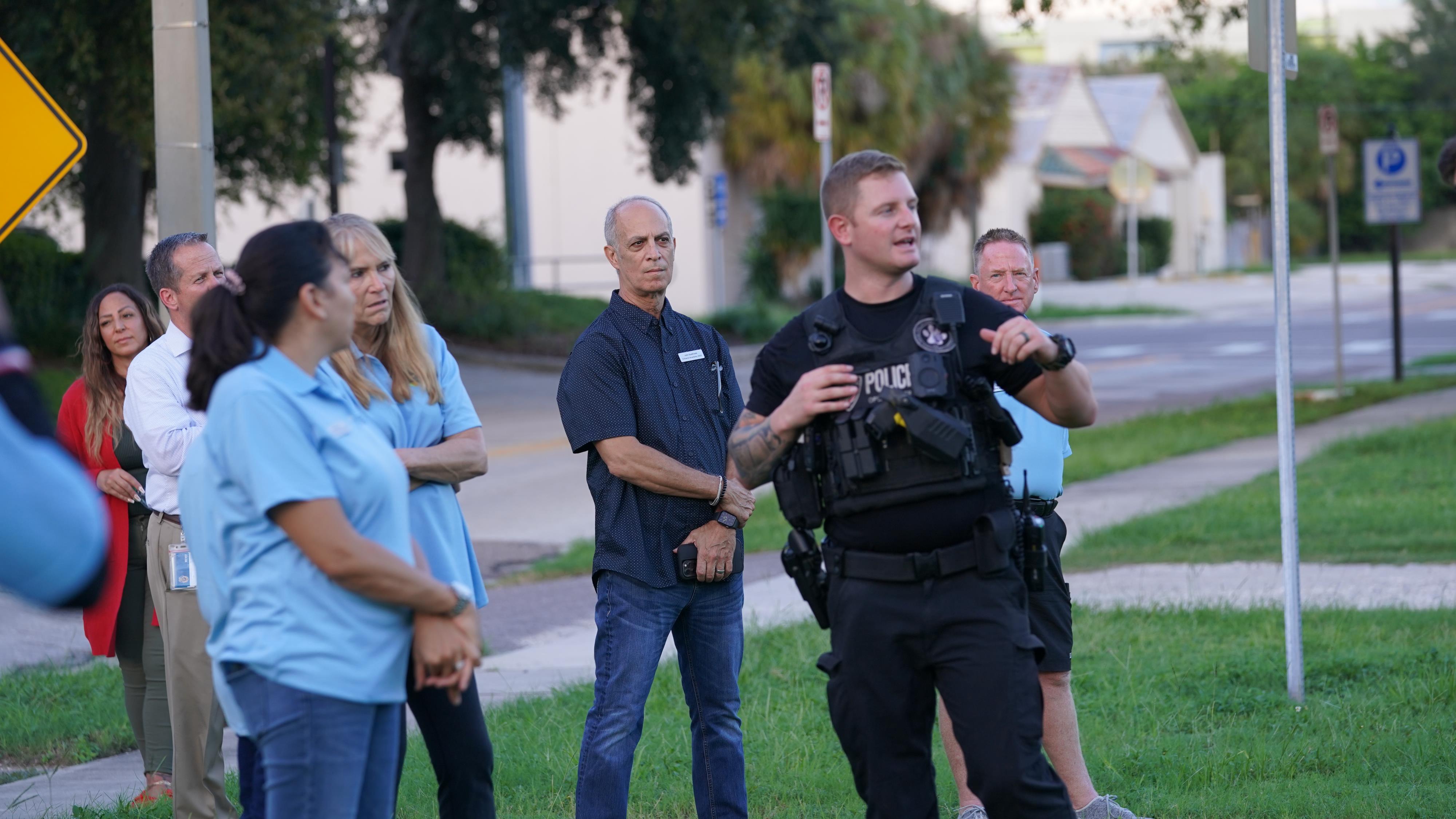 police officer talks to citizens