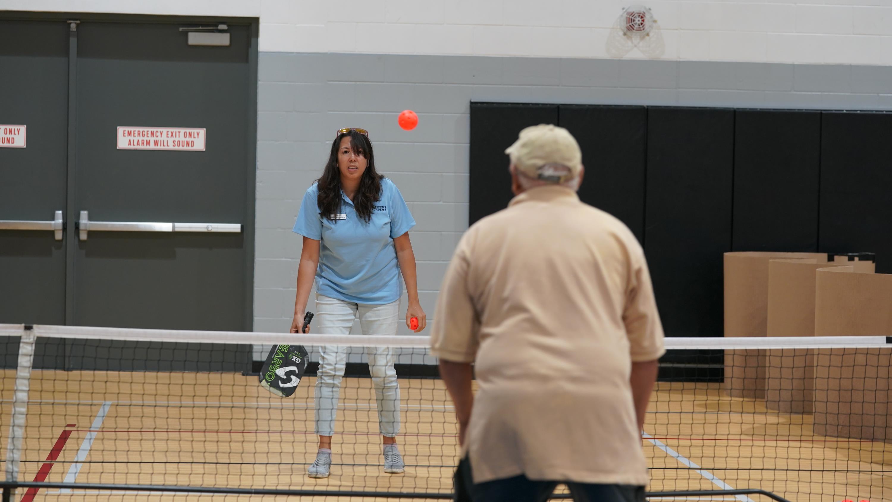 girl playing pickleball